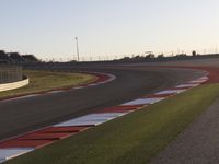 A Scenic Asphalt Road with Clear Skies: Perfect for Racing