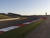 A Scenic Asphalt Road with Clear Skies: Perfect for Racing