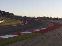 A Scenic Asphalt Road with Clear Skies: Perfect for Racing