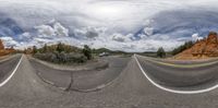 a 360 - angle panoramic view of the road from another side and sky as it is moving behind them