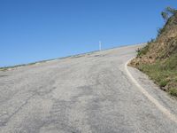 Scenic California Landscape with Curving Road and Blue Sky