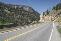 a road with a yellow sign on it that is on the side of the road