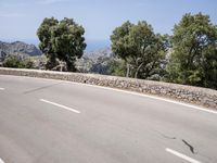 Scenic Coastal Road in Spain: Ocean and Mountain Views