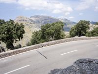 Scenic Coastal Road in Spain: Ocean and Mountain Views