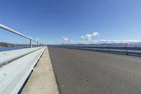 Scenic Coastal Road with Guard Rail: Exploring the Ocean