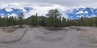 an 360 - turn photo shows a mountain and a wide road between two arrows the way forward