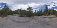 an 360 - turn photo shows a mountain and a wide road between two arrows the way forward