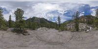 an 360 - turn photo shows a mountain and a wide road between two arrows the way forward