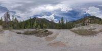 an 360 - turn photo shows a mountain and a wide road between two arrows the way forward