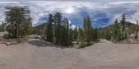 an 360 - turn photo shows a mountain and a wide road between two arrows the way forward