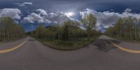 an 360 - turn photo shows a mountain and a wide road between two arrows the way forward