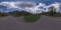 an 360 - turn photo shows a mountain and a wide road between two arrows the way forward