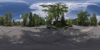 an 360 - turn photo shows a mountain and a wide road between two arrows the way forward