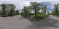 an 360 - turn photo shows a mountain and a wide road between two arrows the way forward