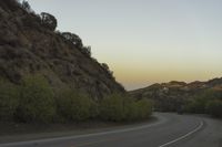 a street that has some rocks on it and the road is yellow and white, with a number of two points up to it