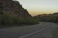 a street that has some rocks on it and the road is yellow and white, with a number of two points up to it