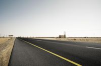 Scenic Desert Road with Mountain Range View