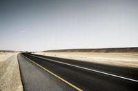 Scenic Desert Road with Mountain Range View