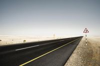 Scenic Desert Road with Mountain Range View