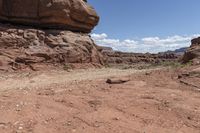 the dirt road leads through the barren terrain of the mountains at valley of fire state park