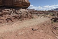 the dirt road leads through the barren terrain of the mountains at valley of fire state park