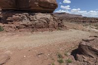 the dirt road leads through the barren terrain of the mountains at valley of fire state park