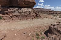 the dirt road leads through the barren terrain of the mountains at valley of fire state park