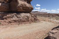 the dirt road leads through the barren terrain of the mountains at valley of fire state park