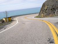 Scenic Drive along California Coast with Clear Sky and Ocean