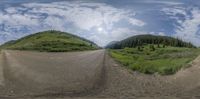 a fisheye lens view of a road in the distance with trees on both sides