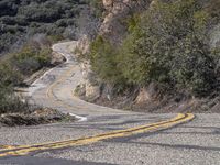 A Scenic Drive Through Low-Lying Mountains with Yellow Trees