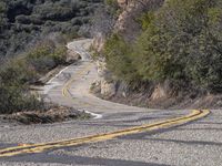 A Scenic Drive Through Low-Lying Mountains with Yellow Trees