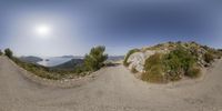 this is two views of the view from the mountain top with the car moving in between them