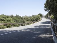 a truck is driving down the winding road at the top of the mountain of a hill