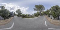 a 3d photo of a curved road surrounded by rocks and trees for a high dynamic view