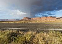 a rainbow appears over the desert area on an autumn day in utah - like country