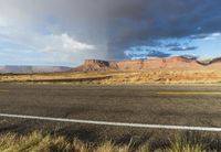 a rainbow appears over the desert area on an autumn day in utah - like country