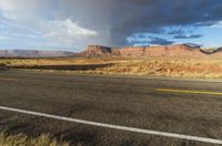 a rainbow appears over the desert area on an autumn day in utah - like country