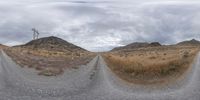 two identical pictures of dirt road in different directions and sky above it, and a street in the middle with dirt road on both sides and side