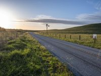 Scenic Highland Road: Surrounded by Mountains and Grass