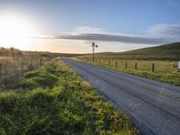 Scenic Highland Road: Surrounded by Mountains and Grass