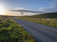 Scenic Highland Road: Surrounded by Mountains and Grass