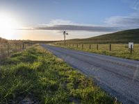 Scenic Highland Road: Surrounded by Mountains and Grass