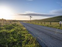 Scenic Highland Road: Surrounded by Mountains and Grass