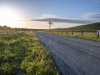 Scenic Highland Road: Surrounded by Mountains and Grass