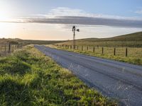 Scenic Highland Road: Surrounded by Mountains and Grass