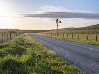 Scenic Highland Road: Surrounded by Mountains and Grass