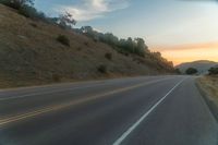 there is an image of a highway at sunset from the window of the vehicle driving down the road