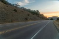 there is an image of a highway at sunset from the window of the vehicle driving down the road