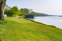 Scenic Landscape with Water, Grass, and Trees in Thailand